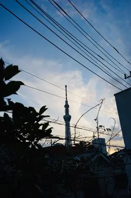 a tower with a cross on it in the sky at MUSICIAN AIR 0014 kyojima in Tokyo