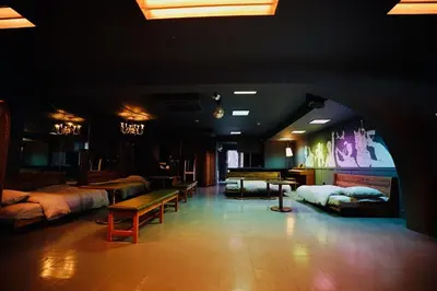 a room with beds and benches in a room with lights at MUSICIAN AIR 0014 kyojima in Tokyo