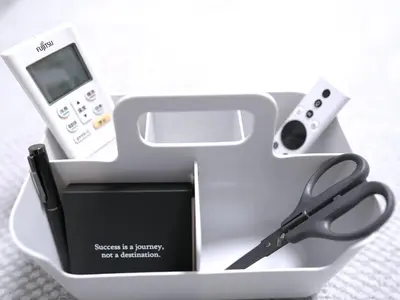 a box with a cell phone and a pair of scissors at Near Asakusa, Projector, Twin and Semi Double Rooms in Tokyo