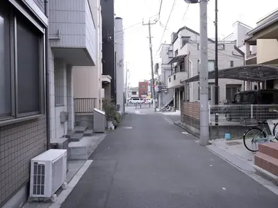 an empty alley with an air conditioner on the side of a building at Near Asakusa, Projector, Twin and Semi Double Rooms in Tokyo