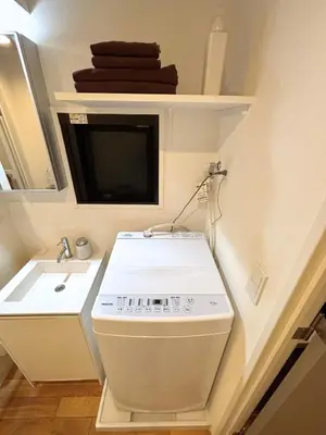 a small bathroom with a toilet and a sink at FARE Akihabara - Stylish Premium Studio 8min from Station 202 in Tokyo