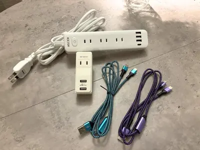 a remote control and various wires on a table at FARE Akihabara - Stylish Premium Studio 8min from Station 202 in Tokyo