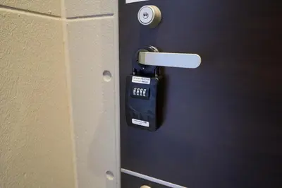 a lock on a door with a tag on it at Serendipity Asakusa in Tokyo