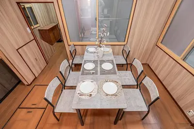 a dining room with a table and some chairs at Sky Tree Stay Hotel 5 8-minute walk from Yahiro Station 3-minute train ride to Tokyo Skytree Station in Tokyo