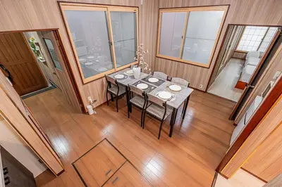 a dining room with a table in a house at Sky Tree Stay Hotel 5 8-minute walk from Yahiro Station 3-minute train ride to Tokyo Skytree Station in Tokyo