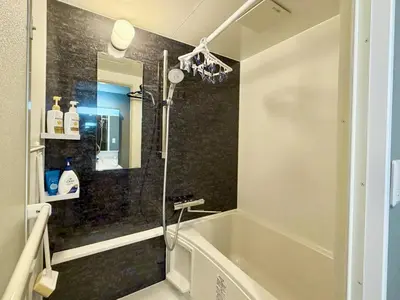 a shower in a bathroom with a bath tub at \u6e0b\u8c37\u611b\u306e\u6cca in Tokyo