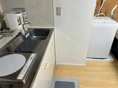 a small kitchen with a sink and a refrigerator at \u6771\u65b0\u5bbf\u30a8\u30ea\u30a2772 in Tokyo