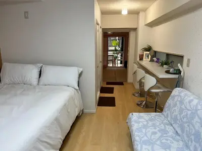 a bedroom with a bed and a desk and a chair at \u6771\u65b0\u5bbf\u30a8\u30ea\u30a2772 in Tokyo
