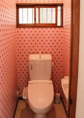 a bathroom with a white toilet and a window at Hostel Hana An in Tokyo