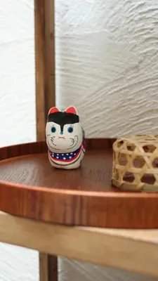 a small toy on a shelf in a room at Hostel Hana An in Tokyo