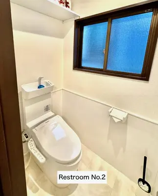 a bathroom with a white toilet with a window at Shimbashi,3BR,2Baths,8ppl in Tokyo