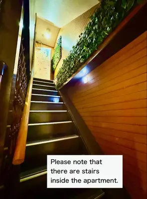 a stairway with a sign that says please note that there are stairs inside at Shimbashi,3BR,2Baths,8ppl in Tokyo