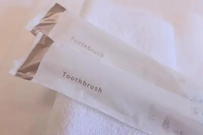 a white bag with the words to nourish on it at Home Story in Tokyo Aerial大島&東京屋 in Tokyo
