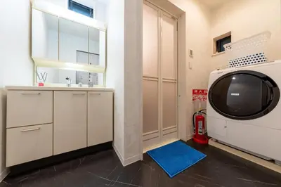 a bathroom with a sink and a tv in a room at Ikebukuro the Anime Mecca NEO TOKYO BASE Fortuna House in Tokyo