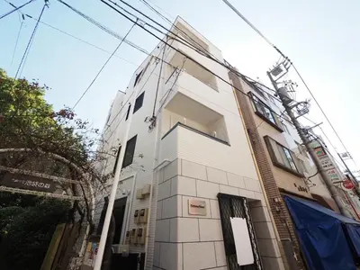a tall white building with an open window at Ikebukuro the Anime Mecca NEO TOKYO BASE Fortuna House in Tokyo