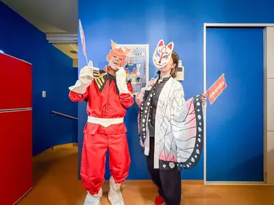 two people dressed up in costumes in a room at Ikebukuro the Anime Mecca NEO TOKYO BASE Fortuna House in Tokyo