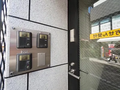a close up of a door with a parking meter at Ikebukuro the Anime Mecca NEO TOKYO BASE Fortuna House in Tokyo
