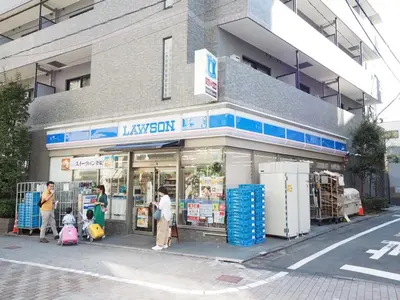a group of people standing outside of a store at Ikebukuro the Anime Mecca NEO TOKYO BASE Fortuna House in Tokyo