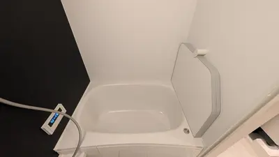 a white toilet in a room with a wall at Brand New Apt! 7 Mins to Ikebukuro, Local Vibe Rino Verdi in Tokyo