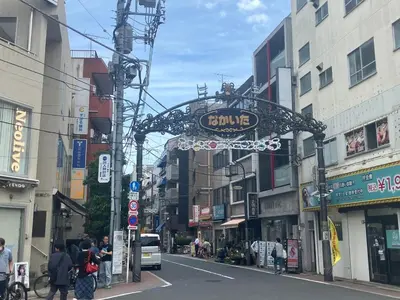 a group of people walking down a city street at Brand New Apt! 7 Mins to Ikebukuro, Local Vibe Rino Verdi in Tokyo