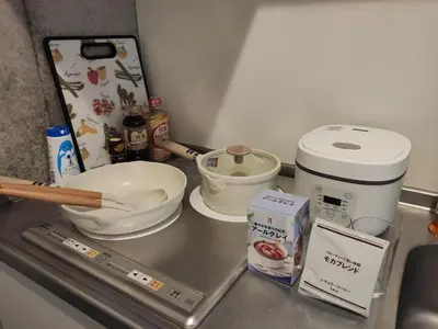 a kitchen counter with a mixing bowl and other ingredients at 301Room,7-minute walk from Uguisudani Station located on the 3nd floor of an apartment-style building Twin room No elevator in Tokyo