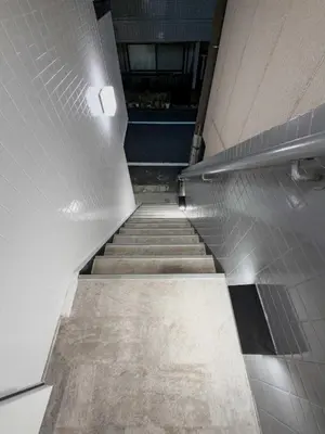 a staircase in a building with ailed floor and a hallway at ISSHUKU Noma \u5317\u65b0\u5bbf -101 Multiple Beds Room 4-6 Guests in Tokyo