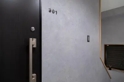a door in a room with a wall at ISSHUKU Noma \u5317\u65b0\u5bbf -101 Multiple Beds Room 4-6 Guests in Tokyo