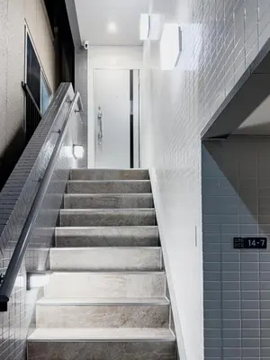 a staircase in a building with a stair case at ISSHUKU Noma \u5317\u65b0\u5bbf -101 Multiple Beds Room 4-6 Guests in Tokyo