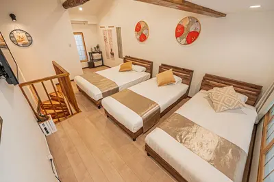 a room with two beds and a television in it at Ginza Stay Tsukishima Station 1-minute walk, Ginza, Shinjuku, Tsukiji Market tram direct, supermarket, next to the canal, Tokyo Bay stroll in Tokyo