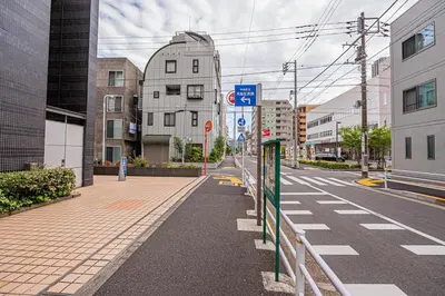 an empty street in a city with buildings at Ginza Stay Tsukishima Station 1-minute walk, Ginza, Shinjuku, Tsukiji Market tram direct, supermarket, next to the canal, Tokyo Bay stroll in Tokyo