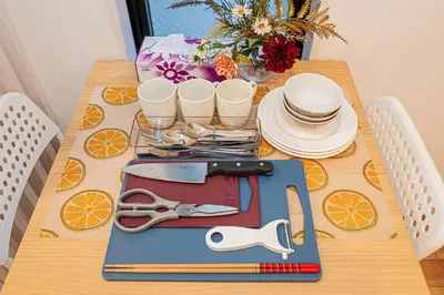 a table with a bunch of utensils on it at Skytree Stay Home, a 4-minute walk from Oshiage Station, a private house with an elevator in Tokyo