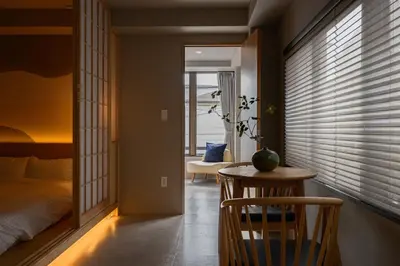 a bedroom with a bed and a table and a chair at Zen Premium Suite Newly Renovated Luxury Home 2King Beds Near Shinjuku in Tokyo