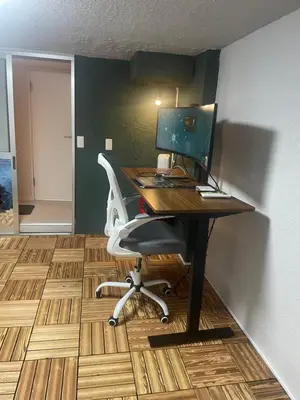 an office with a desk with a computer and a chair at Aila apartment in Tokyo