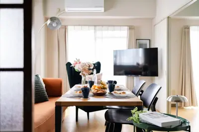 a dining room table with food on top of it at Felizstay 907 in Tokyo