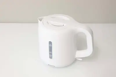 a white electric toothbrush holder sitting on a counter at Ruhe Ikebukuro in Tokyo