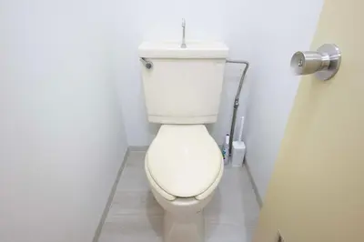 a bathroom with a white toilet with a sink at Ruhe Ikebukuro in Tokyo