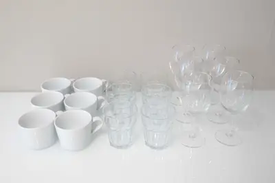 a group of wine glasses and cups on a table at Ruhe Ikebukuro in Tokyo
