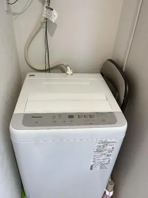 a toilet in a small room with at \u6d45\u8349\u5bfa\u6c11\u6cca in Tokyo