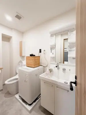 a white bathroom with a toilet and a sink at ISSHUKU Noma \u5317\u65b0\u5bbfI -201 Triple Room in Tokyo