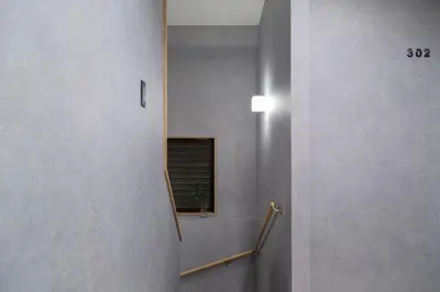 a hallway with a mirror on the wall at ISSHUKU Noma \u5317\u65b0\u5bbfI -201 Triple Room in Tokyo