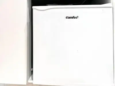 a white refrigerator with the word cancer written on it at 新宿Shin-Ōkubo Aeroland 2 in Tokyo