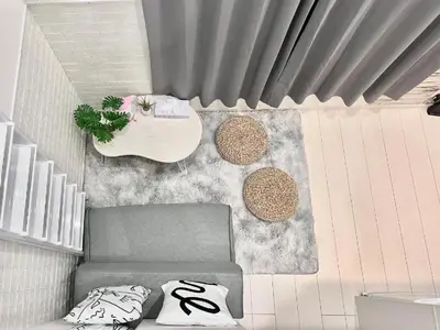 a living room with a couch and a table at 新宿Shin-Ōkubo Aeroland 2 in Tokyo