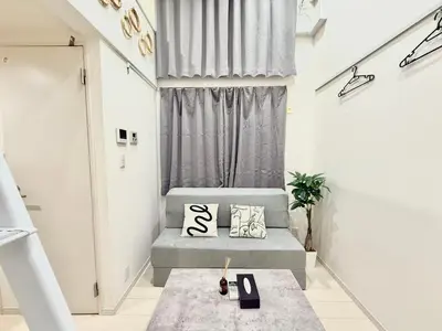 a small living room with a couch and a window at 新宿Shin-Ōkubo Aaanun 6 in Tokyo