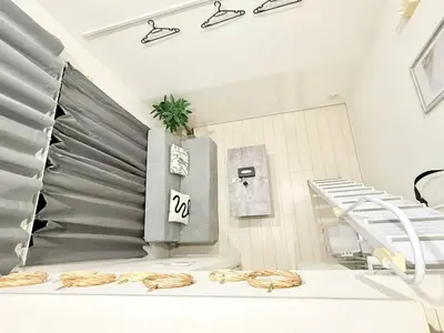 a hospital room with a bed and a staircase at 新宿Shin-Ōkubo Aaanun 6 in Tokyo