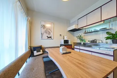 a kitchen with a wooden table in a room at 23Maison-J\u5927\u4e45\u4fdd\u99c5\u8fd1 in Tokyo