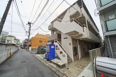 a building with a staircase on the side of it at 23Maison-J\u5927\u4e45\u4fdd\u99c5\u8fd1 in Tokyo