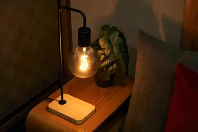 a lamp sitting on a table next to a couch at Wa Modern stay Mukoujima Skytree Asakusa 10min in Tokyo