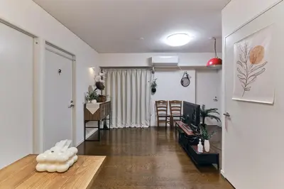a living room with a couch and a table at HigashiNakano 3 rooms 1 bath with 2 different view in Tokyo