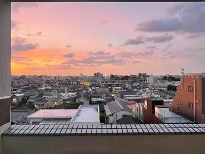 a view of a city at sunset from a balcony at HigashiNakano 3 rooms 1 bath with 2 different view in Tokyo