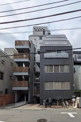 a building with bikes parked in front of it at Tokyo Tower Roppongi walk 4 bed, Direct bus to Shibuya in Tokyo